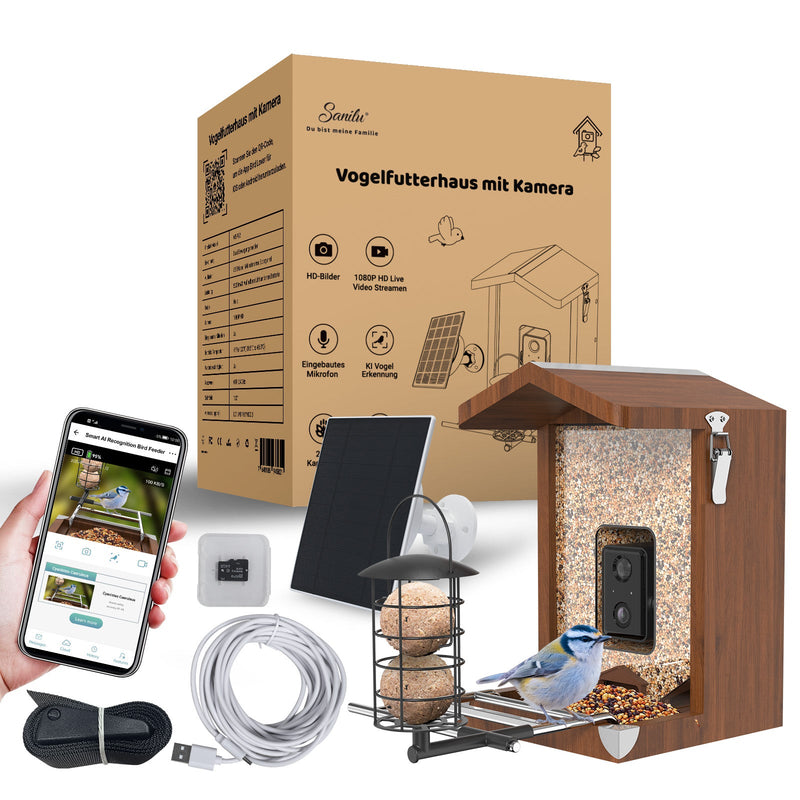 Vogelfutterhaus mit Kamera – Holzhäuschen-Vogelfutterspender mit integrierter Überwachungskamera, Solarpanel, Kabel und Zubehör; Smartphone zeigt die App zur Überwachung.